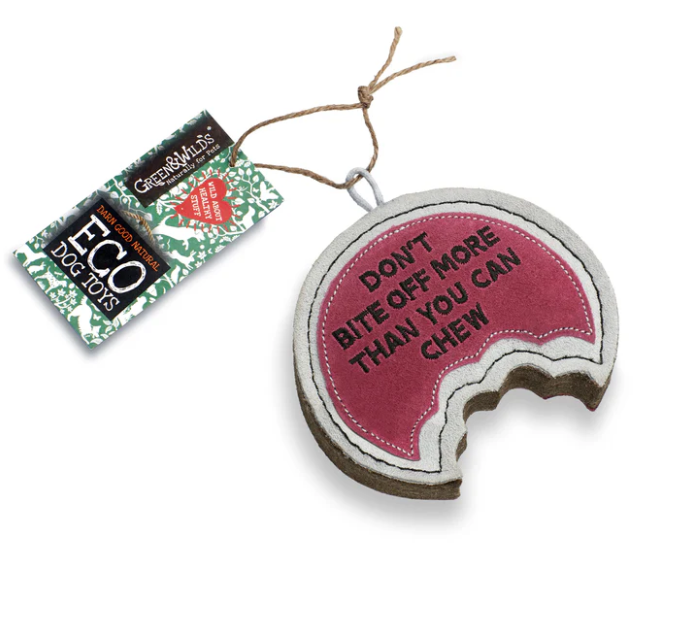 Dog toy with pink interior and text 'Don't bite off more than you can chew' on a white background, featuring a chewed part at the bottom