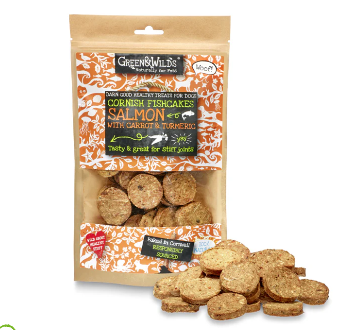Packaging of Green & Wild's Cornish Fishcakes with Salmon & Turmeric for dog treats, displaying the product and its name, along with images of the fishcakes outside the packaging.