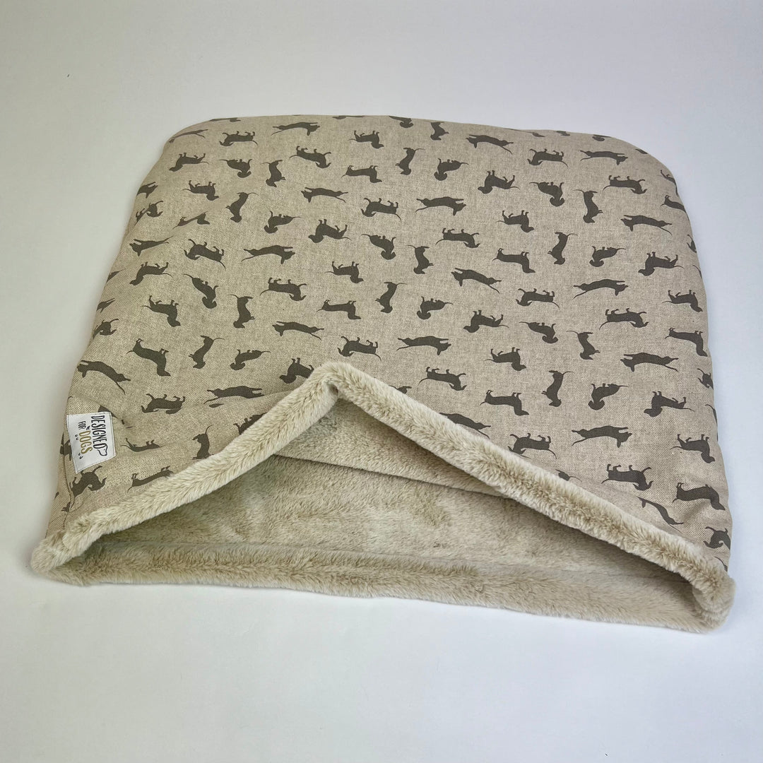 Snuggle sack made from grey coloured Dachshund fabric, with caramel coloured fur inner