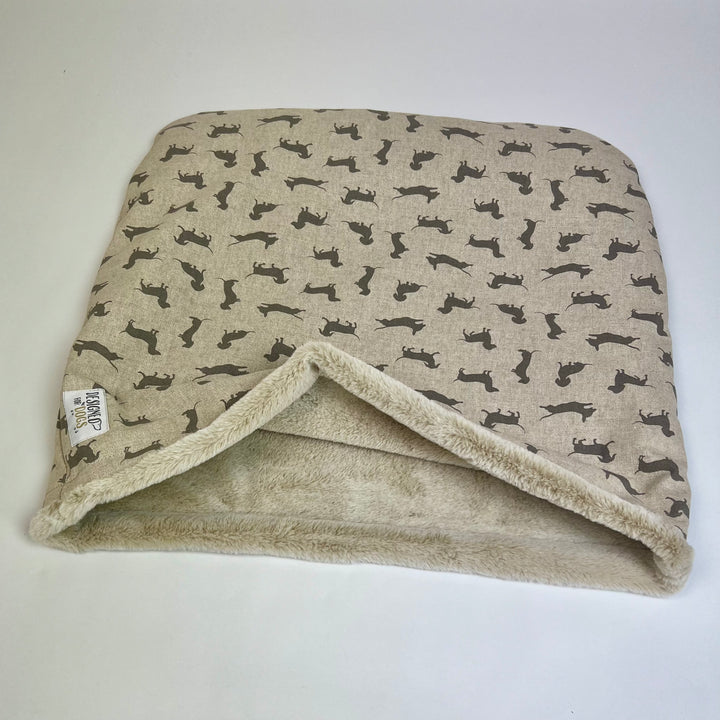 Snuggle sack made from grey coloured Dachshund fabric, with caramel coloured fur inner