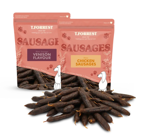 Pile of mini sausages (in both venison and chicken sausage flavour) in front of T.Forrest packaging
