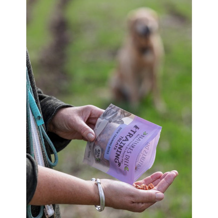 An image of Natures Deli Training Bites being poured from the packet into a hand, showing their small size