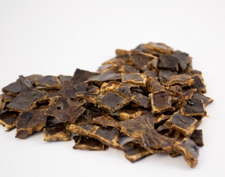 Pile of ostrich liver flakes in the shape of a heart 