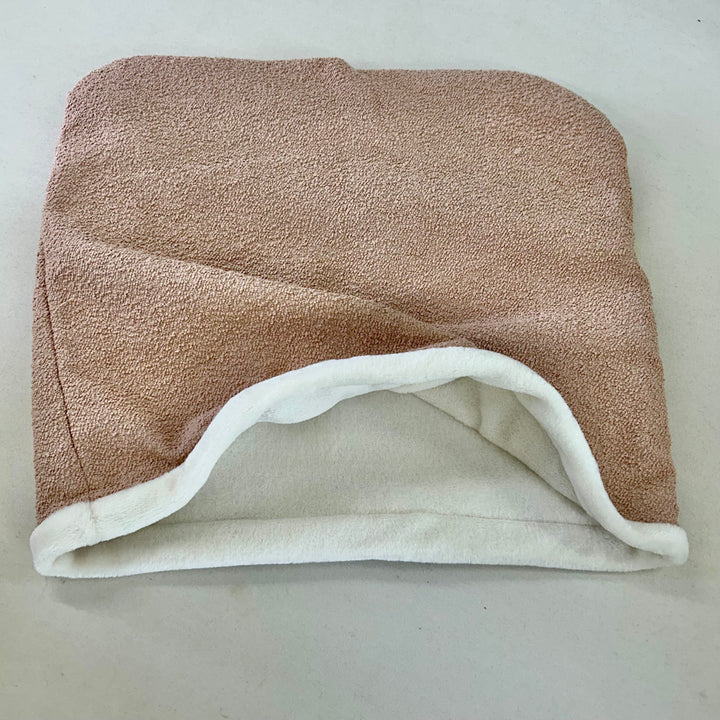 Snuggle sack with light pink bouclé fabric on the outside and cream super soft lining 