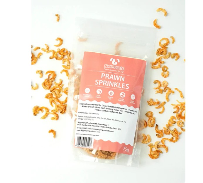 Skipper's prawn sprinkles dog treat packaging with scattered prawn sprinkles around the outside 