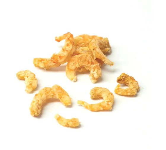 Pile of Skipper's prawn sprinkles dog treats out of the packaging