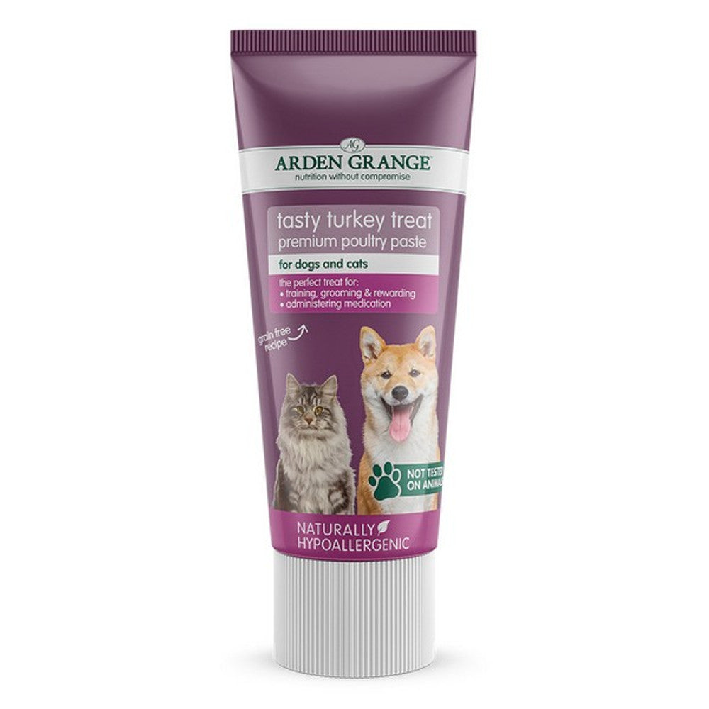 A tube packaging of Arden Grange tasty turkey treat premium pouch paste, indicating suitability for dogs and cats, and highlighting its hypoallergenicity.