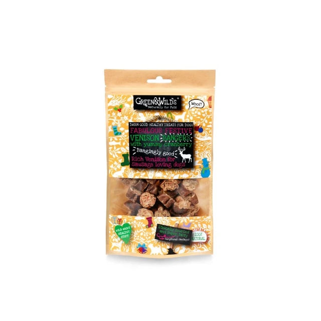 Green & Wilds Venison & Mushroom Hangingly Good dog treats in a clear stand-up pouch with a tan header and colorful printed label, shown on a white background.
