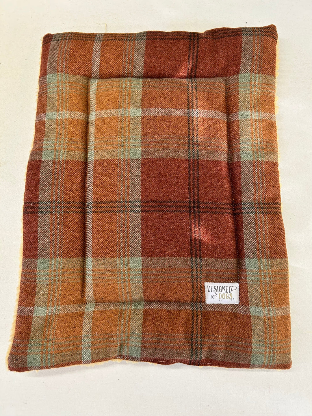 Warm spice tartan small dog mat with designed for dogs label 
