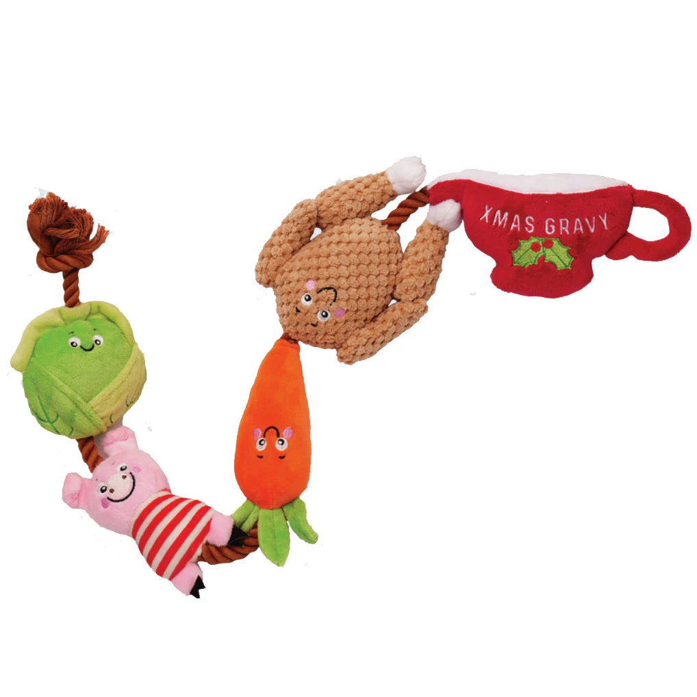Dog toy set with turkey, vegetables, and a cup labeled 'Xmas Gravy' on a white background