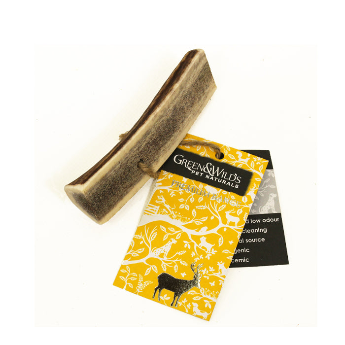 Green & Wild's antler dog chew, a small section of antler cut in half, exposing the centre of the antler 