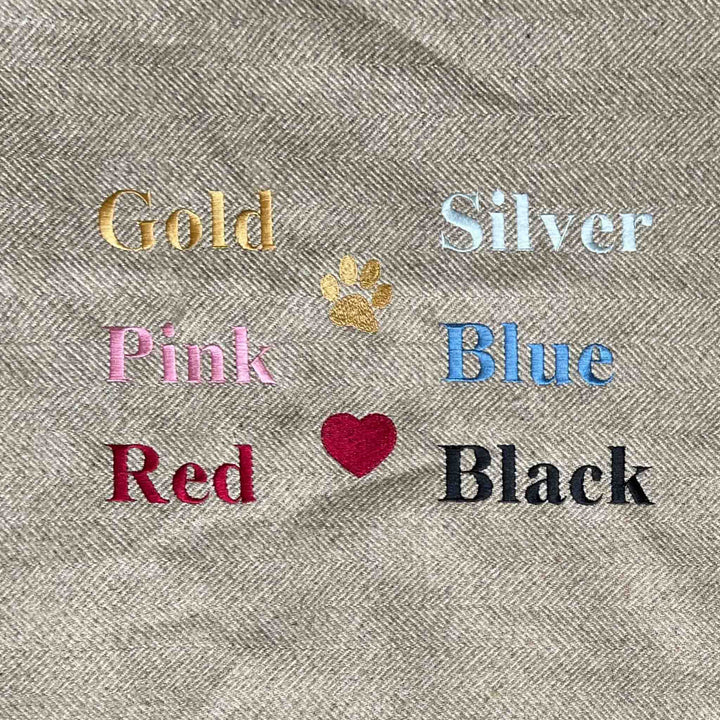 Examples of the embroidery colours available to go on the personalised dog toys, as well as a paw print and heart