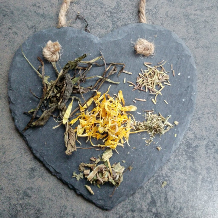 Soothing Skin Salve 15g ingredients on black slate heart 